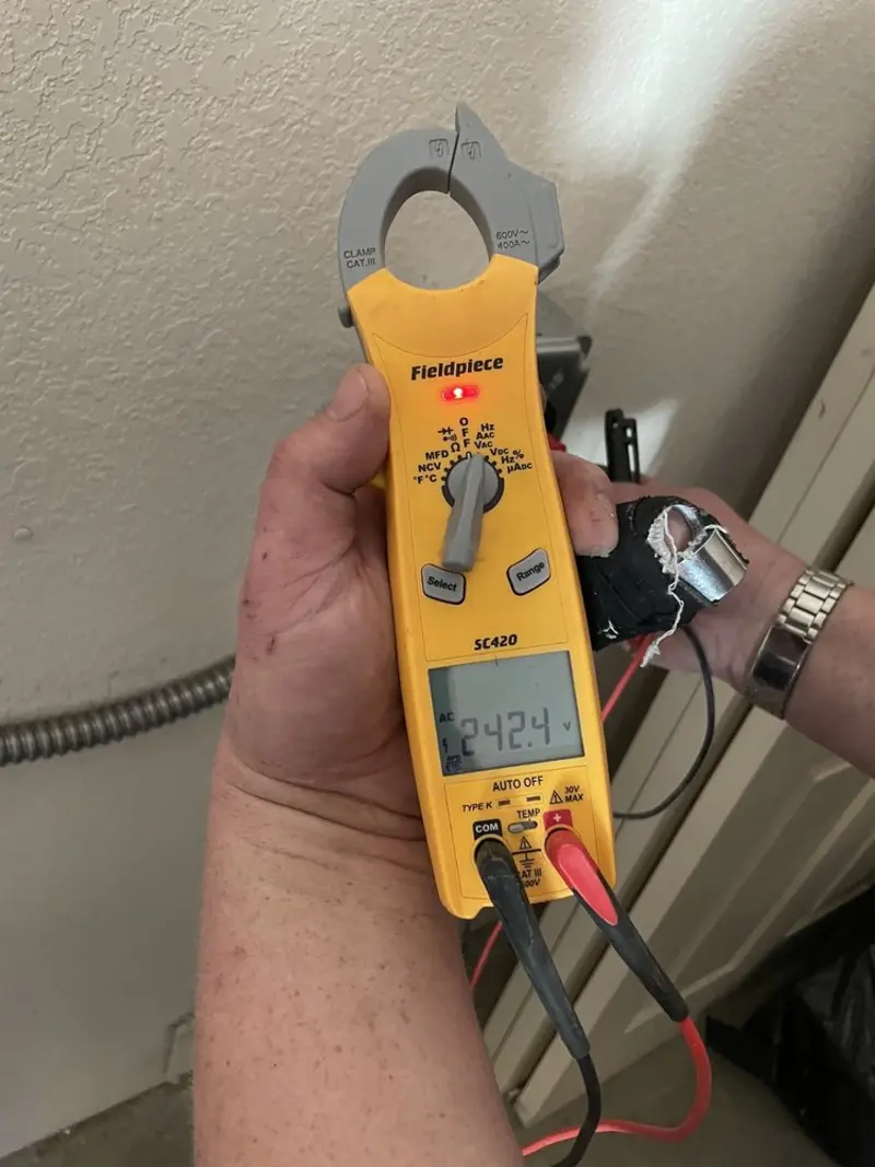 Voltage testing with clamp meter during Generator Installation in Cheyenne
